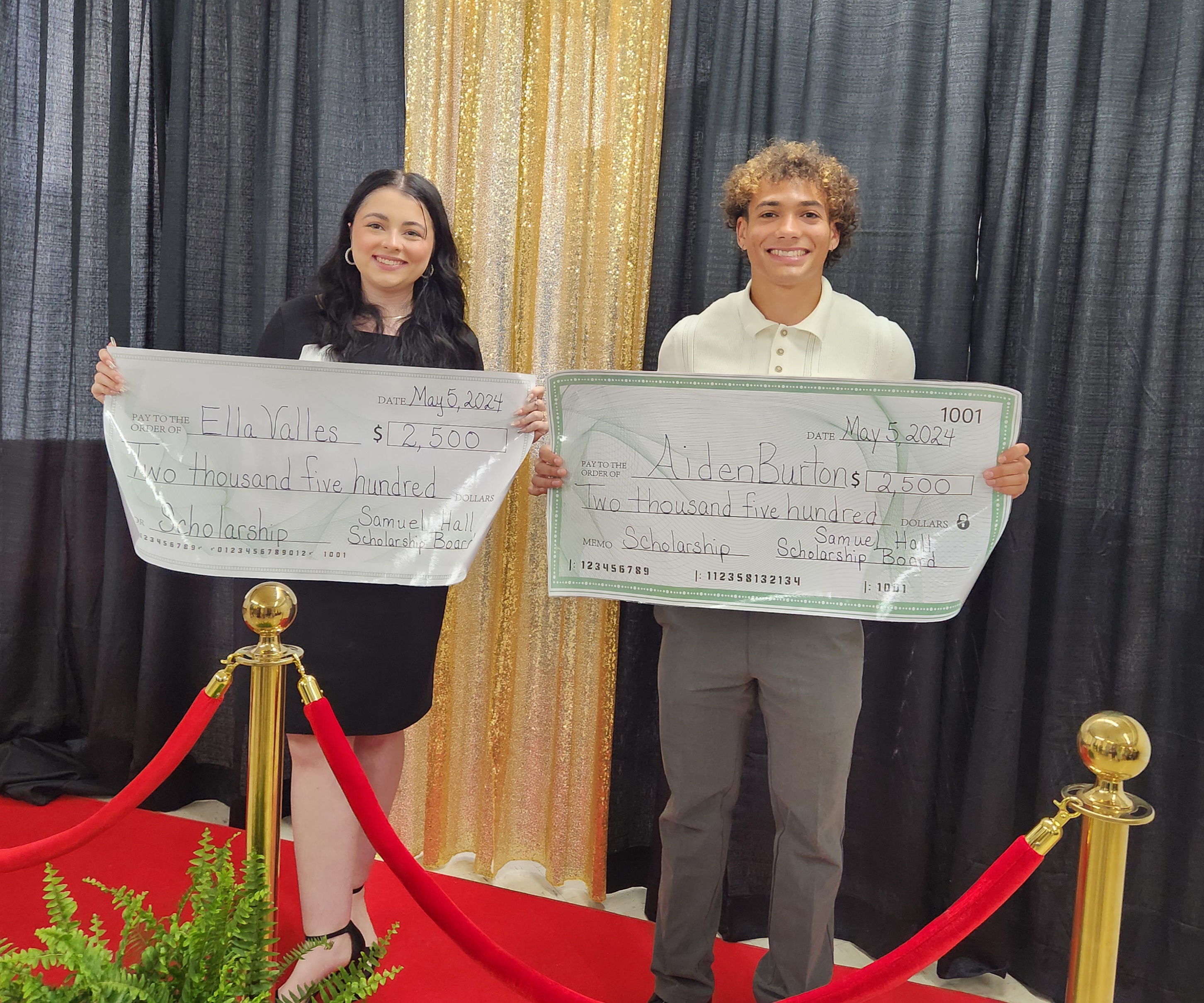 2024 scholarship recipients Ella Valles and Aiden Burton holding their $2,500 scholarship checks